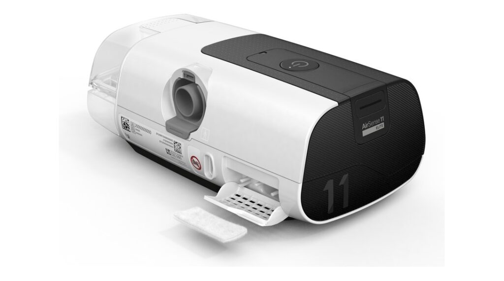 ResMed AirSense 11 CPAP machine with the filter compartment open for servicing